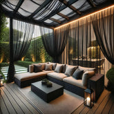 Draphelle outdoor black tulle curtain panels arranged for a wide 20-foot backdrop.