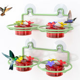 Dreamdrawer window hummingbird feeder with green base and strong suction for secure glass mounting.