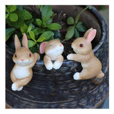 Ebrima bunny figurine plant pot hanger adds charm to outdoor pots and porches.