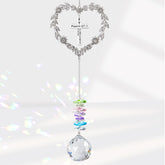 Elivida heart-shaped suncatcher with cross catching sunlight to inspire faith.