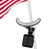 Enrybia flag pole light front view illuminating a flag at dusk