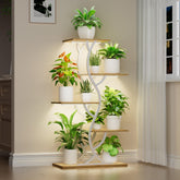 EVAWOO plant stand with grow lights set up in a corner.
