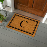 Evergreen Flag monogram C doormat with natural coir, ideal for indoor and outdoor use.