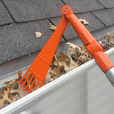 EZ SMART Mini Rake Head clearing leaves and debris from gutters from the ground.