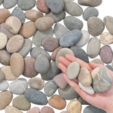 Fahaxiki natural river rocks along a garden path show texture.
