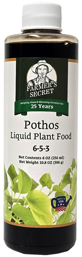 Farmer's Secret Pothos liquid food bottle label emphasizes nutrient-rich formula for strong roots