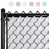 Fenpro privacy tape on a chain-link fence in Arctic White roll for private outdoor space.