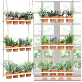FillTouch 3-tier hanging herb planter on wall for easy herb access.