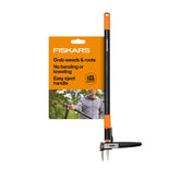 Fiskars 39-inch stand-up weeder in action reducing knee strain