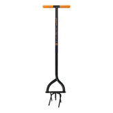 Fiskars 40in steel tiller in action reduces kneeling and loosens tough soil.