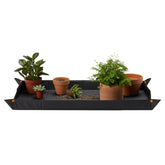 Fiskars Large Repotting Mat unfolded to full size for ample workspace during potting