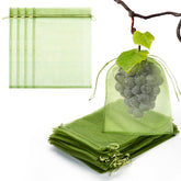 FloraSea fruit protection bags on apples using breathable green mesh for pest deterrence