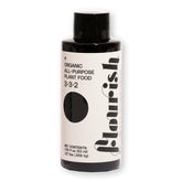 Flourish Plant Food bottle pour shows precise dosing for thriving indoor greenery.
