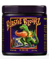 FoxFarm Beastie Bloomz bottle poised for feed to boost mid-flower development.