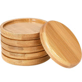 Frienda bamboo round plant saucer with raised edge catches excess water and soil spills.