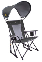 GCI Outdoor Sunshade Rocker open in sunlight at a campsite, featuring smooth rocking action