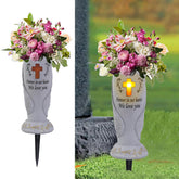 Generic cemetery vase with angel wings and cross, ideal for memorial bouquets in gardens.
