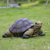 Generic weather-resistant turtle statue in the garden offers durable outdoor charm.