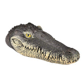 Geniff floating alligator head in water deters pests and protects pond life.