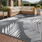 GENIMO outdoor rug palm leaf design, ideal for patios and picnics.