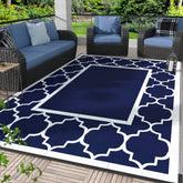 GENIMO outdoor rug blue and white foldable on a sunny patio for easy, quick-dry setup