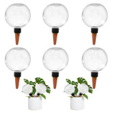 GEWOSI self-watering globes in pots provide ongoing hydration for indoor plants.