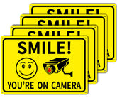 Giftape Smile On Camera sign 8x12 aluminum for clear outdoor visibility.