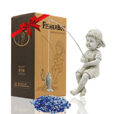 Goodeco Fisherboy statue beside pond edge, adds playful charm for outdoor spaces