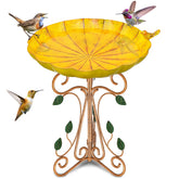 Gouisalin vintage bird bath in garden invites visiting birds.