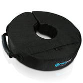 Gravipod 14-inch weight bag stabilizing a patio umbrella on a windy deck