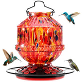 Grete Gotye sunrise red blown glass hummingbird feeder attracts hummingbirds with durable outdoor design