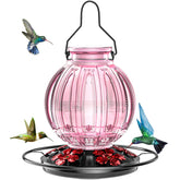 Grete Gotye pink glass hummingbird feeder outdoors attracts hummingbirds in outdoor spaces