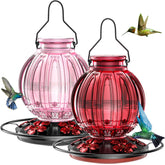 Grete Gotye glass hummingbird feeder in red and pink attracts hummingbirds to your garden.