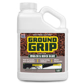 Ground Grip Glue applied to mulch coverage for a secure garden bed.