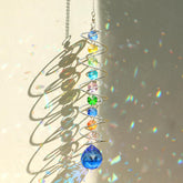 GWAHSA sun catcher gazing ball with spiral tail creates sunlit rainbows on windows.