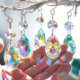 H&D HYALINE & DORA teardrop crystal 38mm pendant sparkles in sunlight, creating colorful reflections.