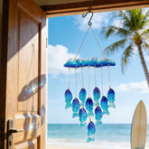 H&D Hyaline & Dora blue sea glass wind chime shimmering in sunlight for outdoor decor.