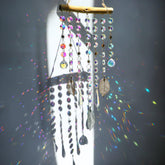 HDCRYSTALGIFTS 13-inch hanging window suncatcher creates rainbow reflections in sunlight.