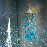HDCRYSTALGIFTS bluish 21.5 inch crystal suncatcher casting rainbow colors through sunlight