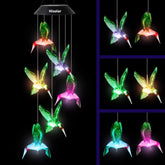 HiSolar hummingbird solar wind chimes illuminate gardens with color-changing LEDs at night.