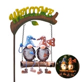 HONGLAND gnome swing welcome sign glowing at night to greet guests.