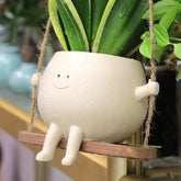 HUNTHAWK swing face planter in resin for vibrant indoor and outdoor display.