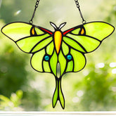 IDEA SHOW Luna Moth suncatcher glows in sunlight, brightening windows with vibrant stained glass color.