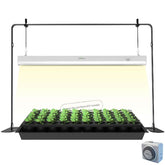 iGrowtek 2ft grow light on stand illuminating seed starting trays