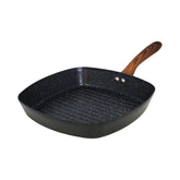 IMUSA Madera 11-inch ceramic grill pan with spacious surface for grilling burgers.