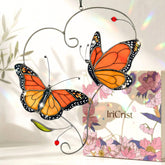 IriCrist Monarch butterfly suncatcher on a branch brightens window display