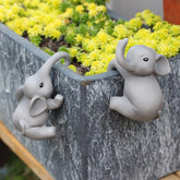 JARPSIRY elephant planter huggers pair perched on a rim for playful charm.