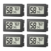 JJMTDS mini hygrometer display showing clear readings for quick room checks