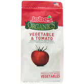 Jobe's Organics granules on tomato plants for healthy yield.