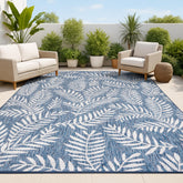 Jonathan Y palm frond rug in navy and ivory for patio ambiance and easy cleaning.